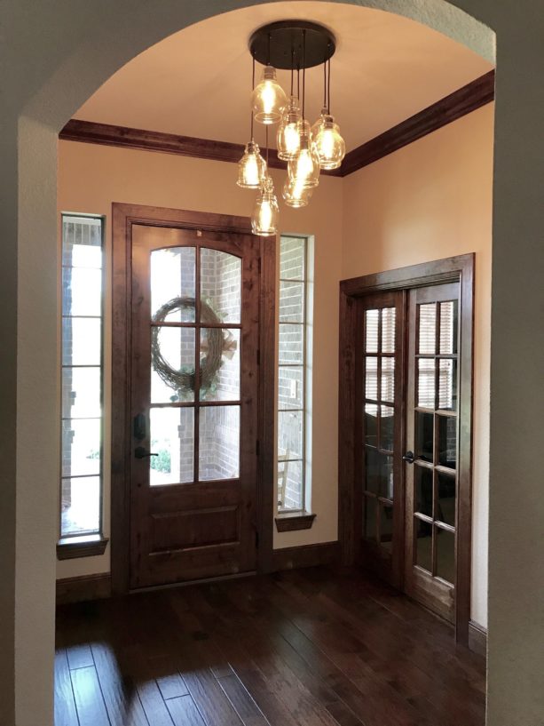 transitional small entryway with dark wood flooring