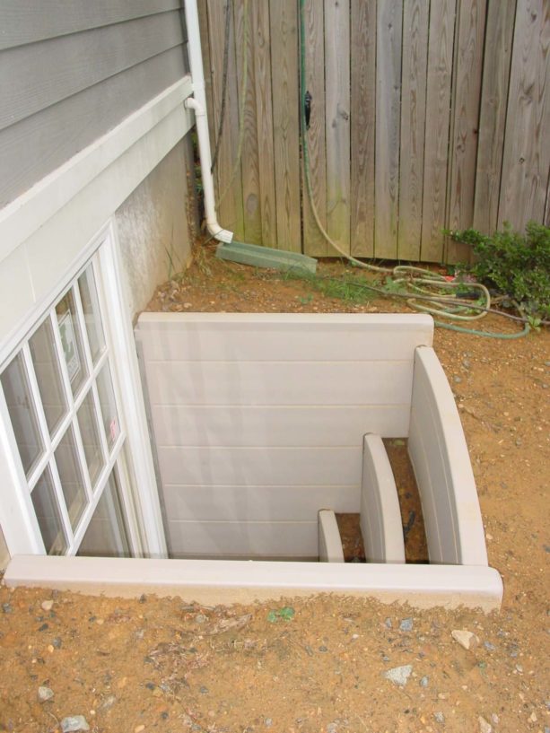 white basement window well ideas with raised beds for plants