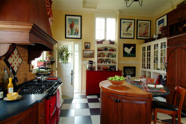 combination of black and white tile kitchen floor with the cherry wood element
