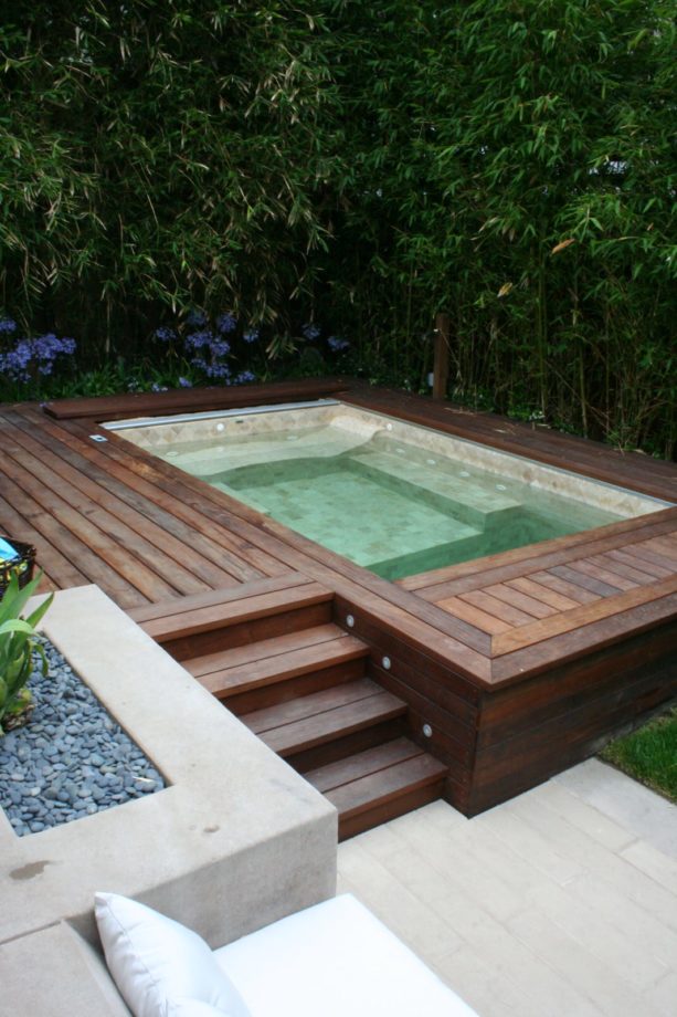 covering concrete steps and the entire poolside area with cumaru wood