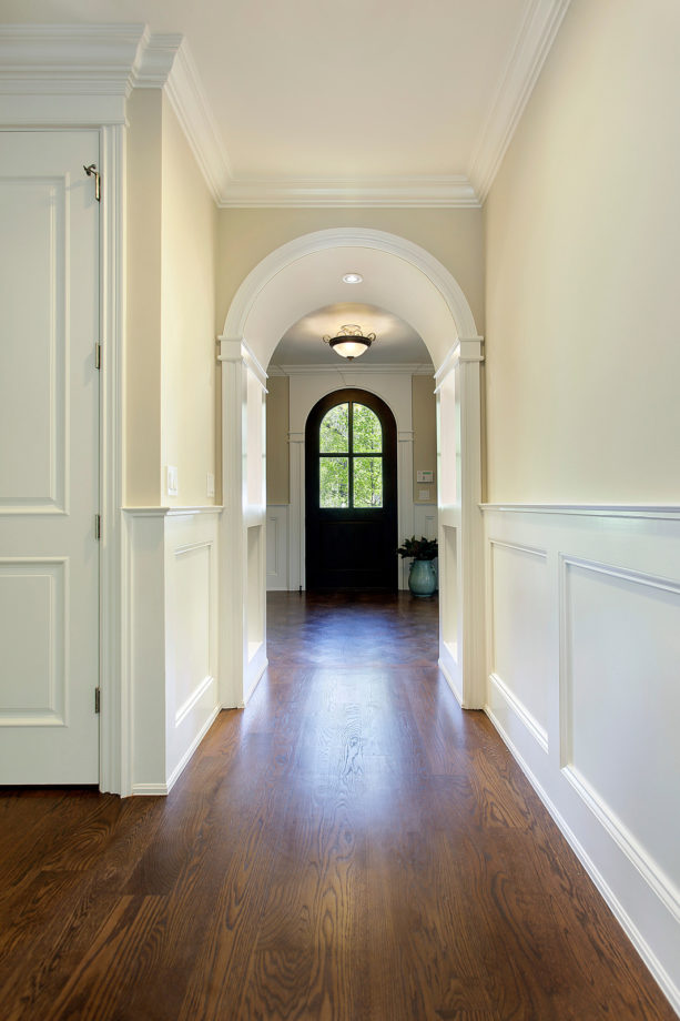different patterns of wood floors in adjoined entryway and hallway