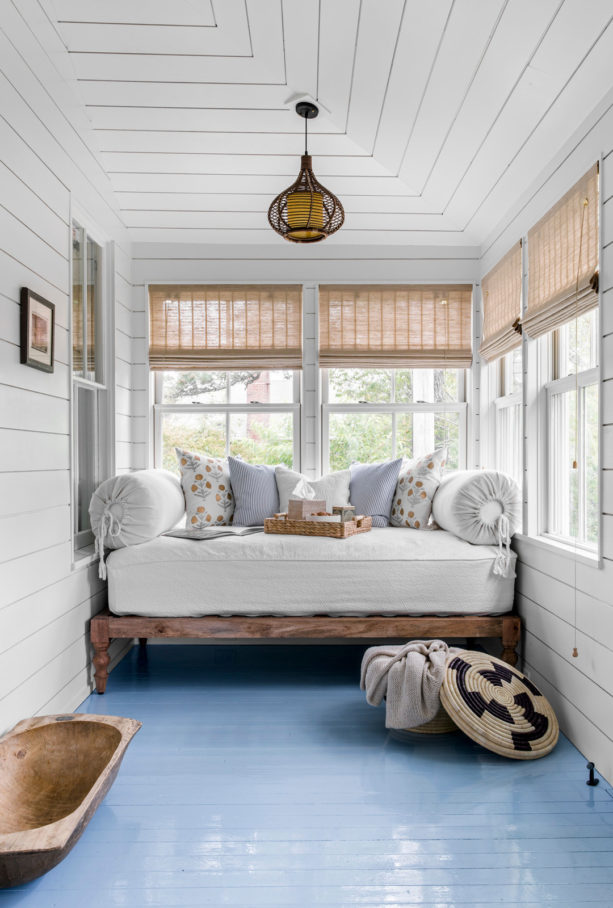 enclosing a beach-style porch with painted wood siding for living space