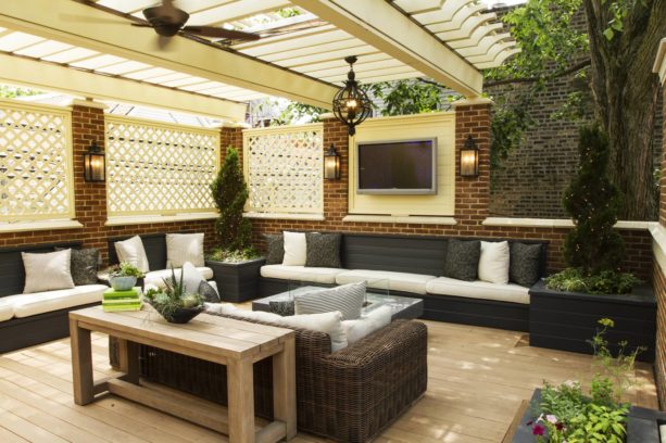 enclosing a classic back porch with decorative wood panels and bricks for living space