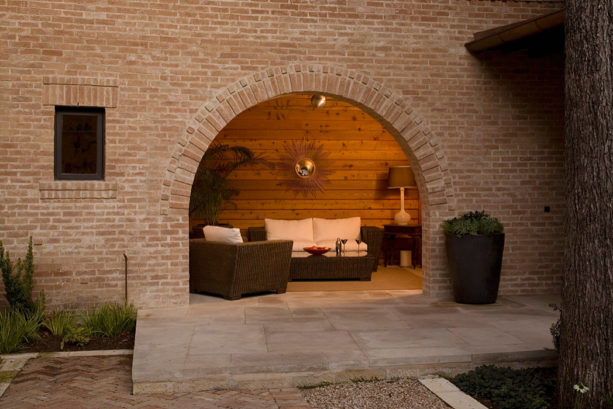 enclosing a mediterranean porch with bricks and mortars for living space