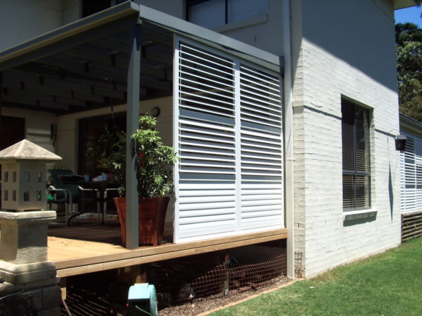using aluminum shutters to enclose a porch for living space