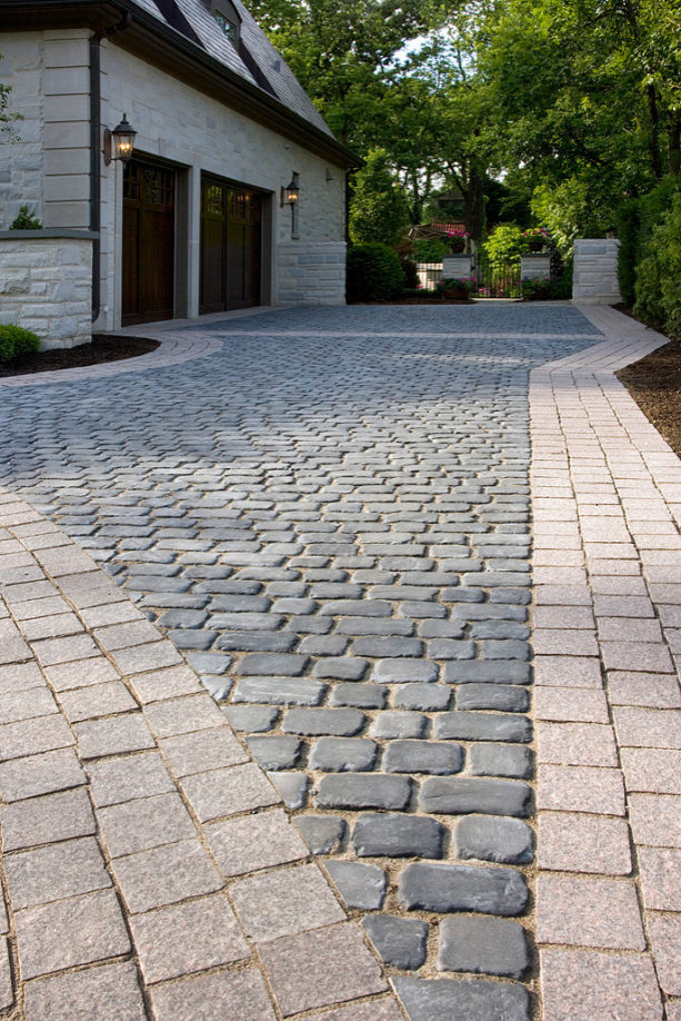 using courtstone of unilock concrete pavers in belgian blue color to widen a driveway