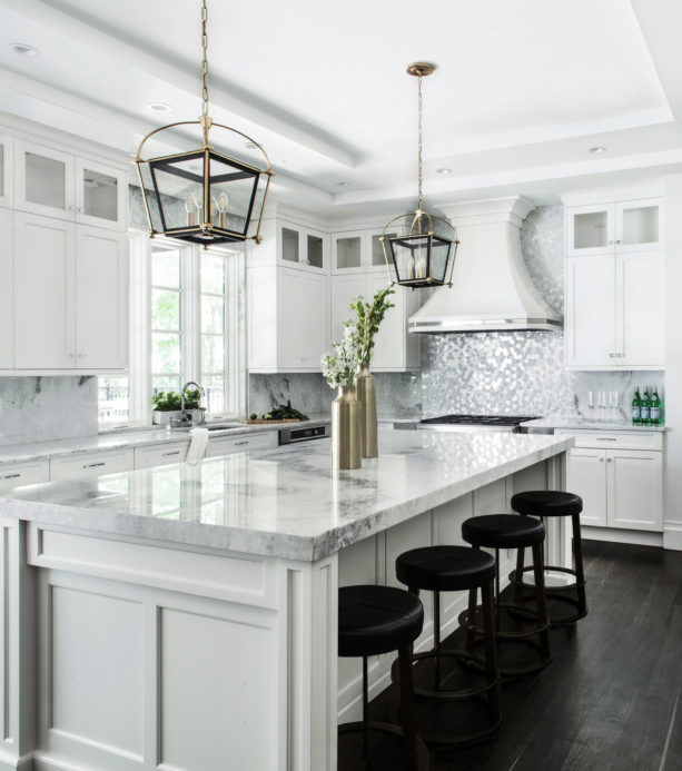 brookhaven alpine white stacked wall cabinets and dark ebony stain floor in a huge kitchen