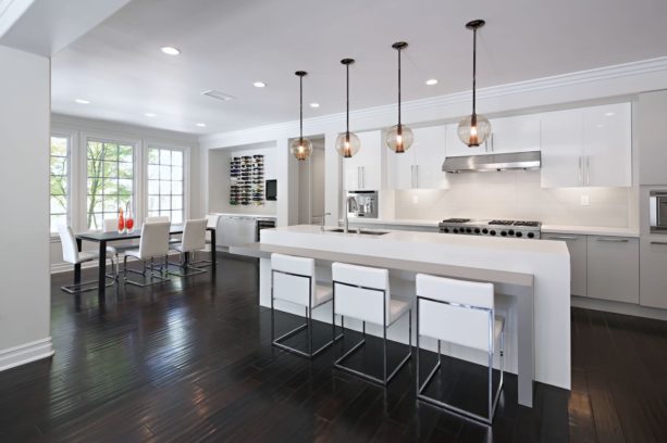 contemporary kitchen with white flat-panel cabinets and dark engineered wood floor