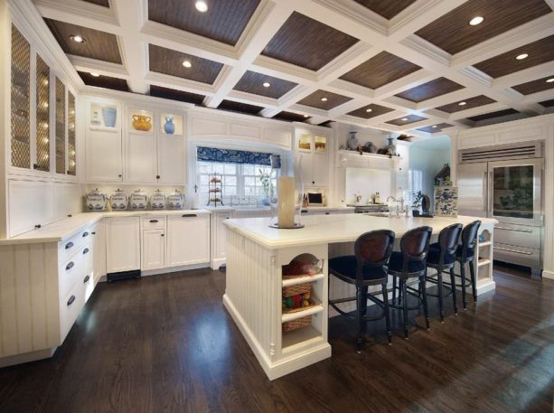 dark custom-stained oak floors and off-white cabinets in a traditional kitchen