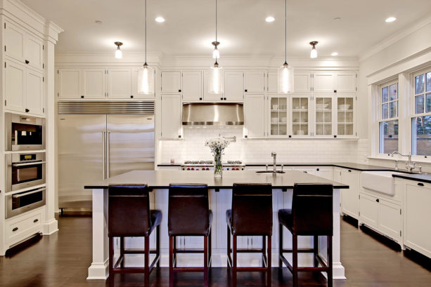 dark stained wood floors combined with cloud white kitchen cabinets