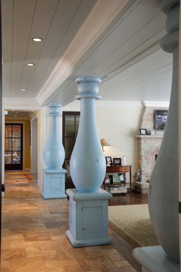 decorating whimsical support beam in a timeless hallway