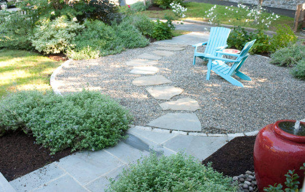 eclectic landscape with pea gravel walkway and flagstone stepping stones set upon