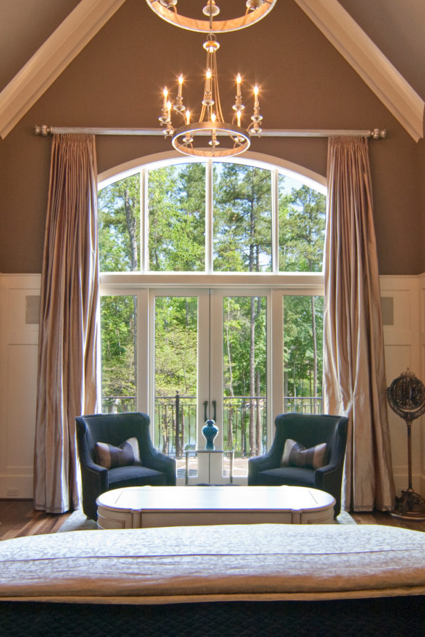 high curtain window treatment for an arched french door to a patio