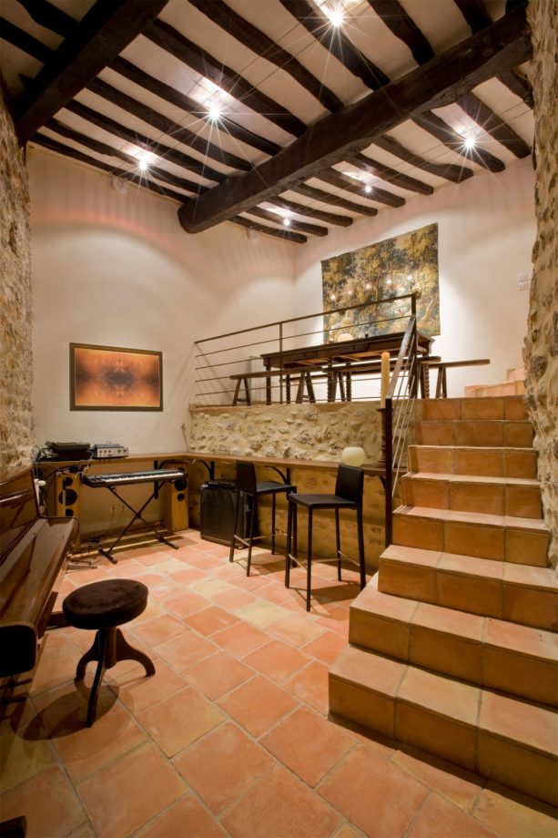 interior of a music room and an entertaining house space with a split level