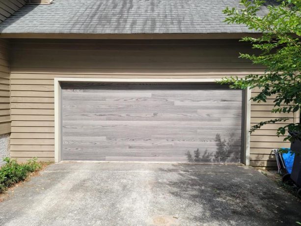 sleek and clean lines of flush panels garage doors with mid-century design