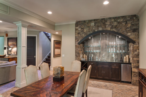 timeless dining room with a built-in cabinet for a bar