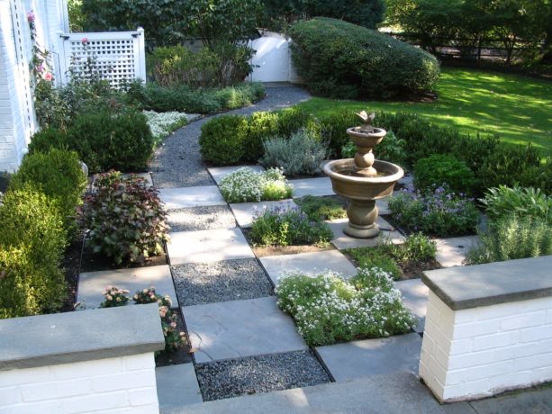 traditional landscape with pea gravel walkway and pennsylvania bluestone stepping stones