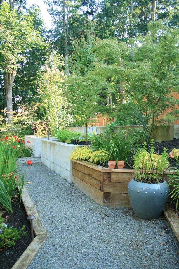 combination of raw concrete and raw wood retaining wall