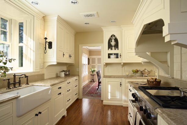 tudor kitchen with white cabinets with black hardware from ashley norton