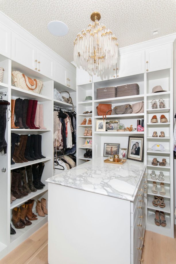 using a combination of the elegant chandelier and ceiling light as a walk-in closet lighting