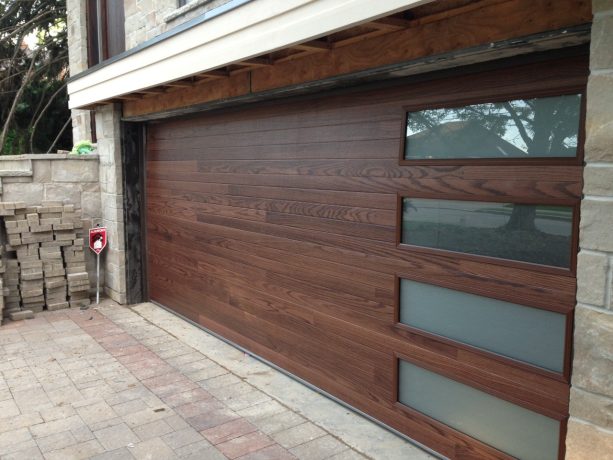 dark mahogany plank garage door with long panel frosted glass