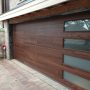 dark mahogany plank garage door with long panel frosted glass