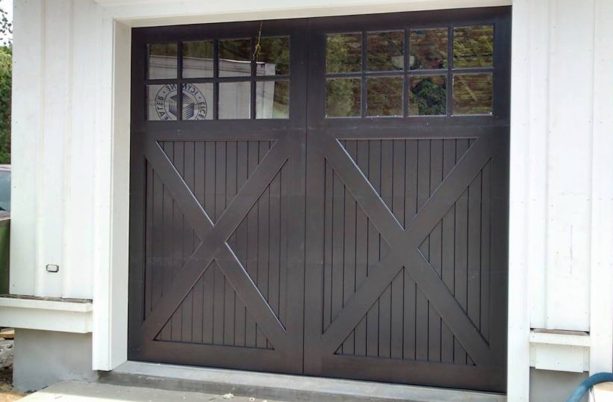 dark painted x-braced wood panels garage door
