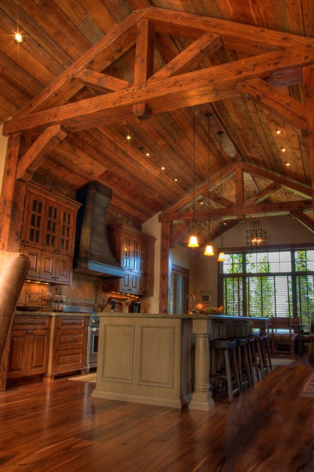 reclaimed fir wood panels in a rustic kitchen’s vaulted ceiling