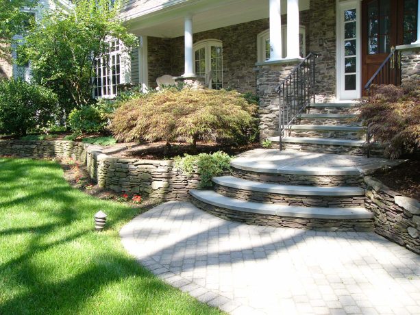 a curvy landing that separates curved and square shaped front stairs