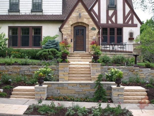 a series of front stairs with landings to embrace a steeply sloped front lawn