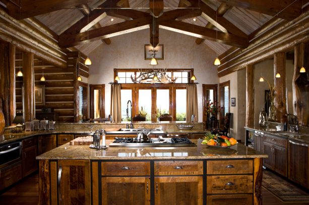bright and spacious log cabin kitchen with high ceiling and large windows