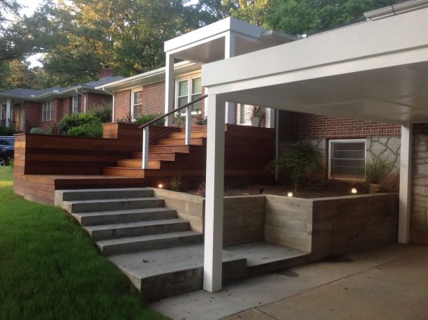 combination of concrete and wood front stairs and landings in an l-shaped staircase