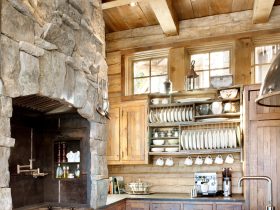 combination of reclaimed oak and natural stone element in a log cabin kitchen