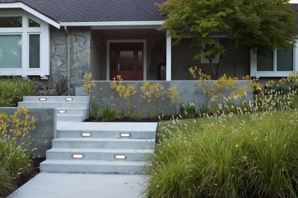 concrete front stairs with a landing to change direction