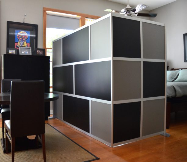 custom black and gray panels as a stylish studio apartment room divider