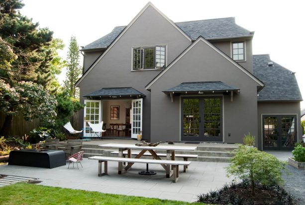 dark gray exterior and black roof color scheme in a tudor home