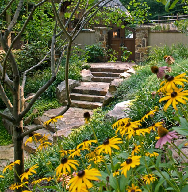 front stairs and landings that are similarly made of stones in a rustic design