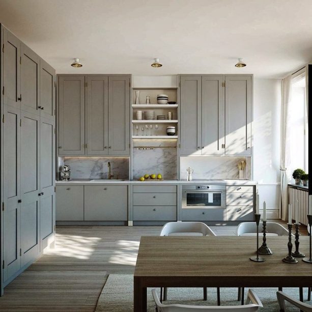 gray shaker cabinets with white marble countertops and backsplash for a blending look