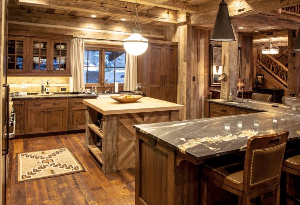 log cabin kitchen made of reclaimed barn wood with a lot of lighting to spice up the room