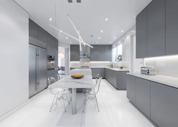 mid-sized kitchen with gray flat panel cabinets and sleek white countertops
