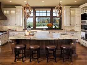 modern rustic kitchen with a combination of distressed white cabinets and wood elements