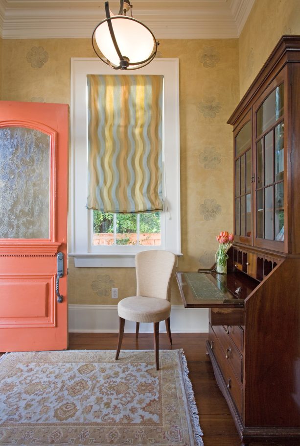 orange coral front door painted in sherwin williams - gladiola surrounded by yellow walls