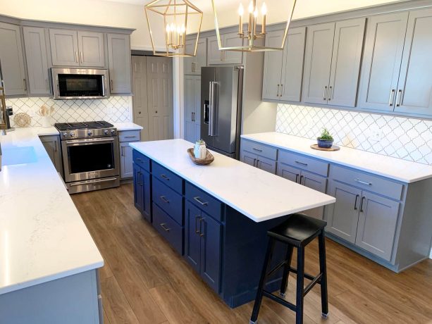 prairie fog painted cabinets in gray color with bright white hanstone quartz countertops for a transitional look