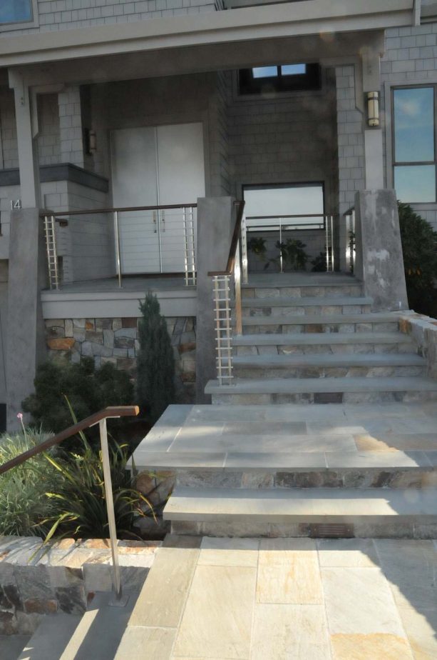 quartzite landings are bordered by bluestone slabs that match the treads of the front stairs