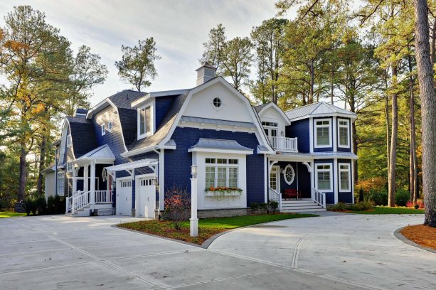 rustic black gambrel roof and navy blue color scheme to create a coastal look