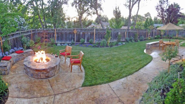 the idea for concrete paver landscaping in a rustic style with a fire pit