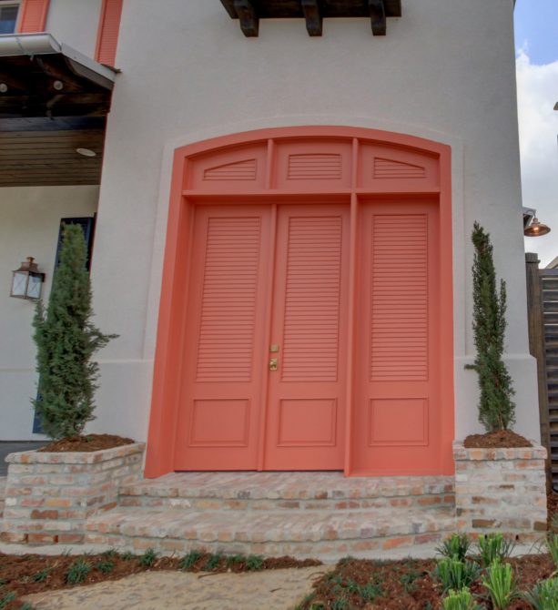 transitional exterior with a set of the double coral front door