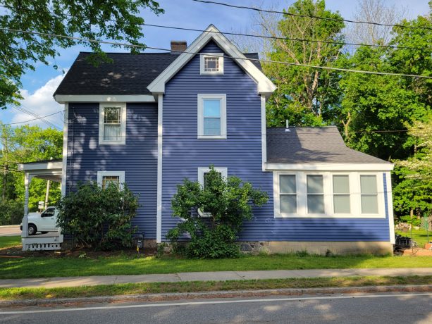 true blue siding and black shed roof color scheme