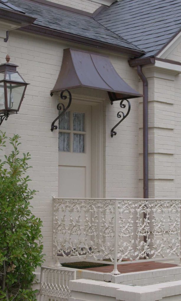 victorian style awning with ornaments for a traditional front door