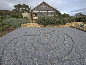 asian rock garden with pea gravel and mexican beach pebbles creating a labyrinth without plants